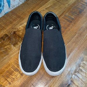 Black Nike slip ons